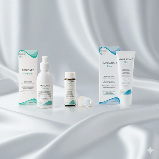 Acne treatment products including bottles and boxes on a gray background