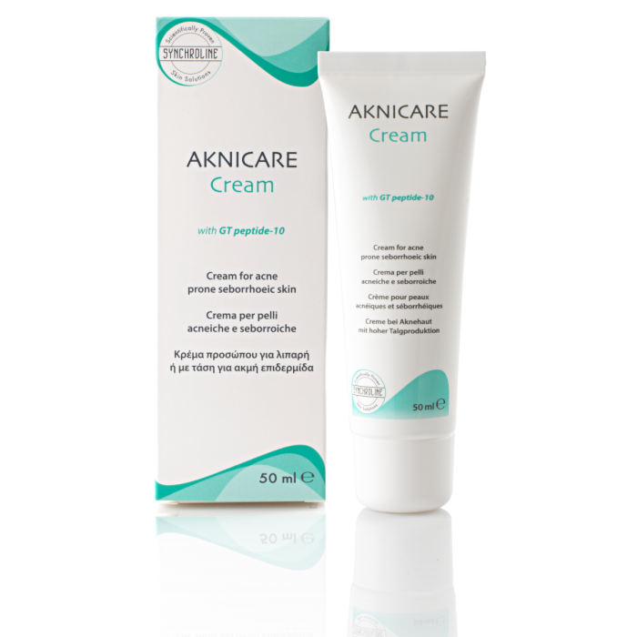 AKNICARE Cream packaging and tube, a clear skin acne treatment tube and packaging on a white background