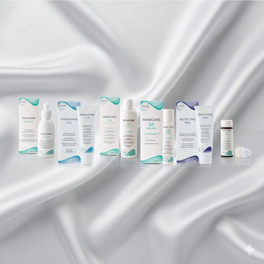 Various acne skincare treatmment products on a silver satin background